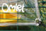 Nærbilde av Omlet klart deksel og strikksnorer på en Eglu Cube hønsegård